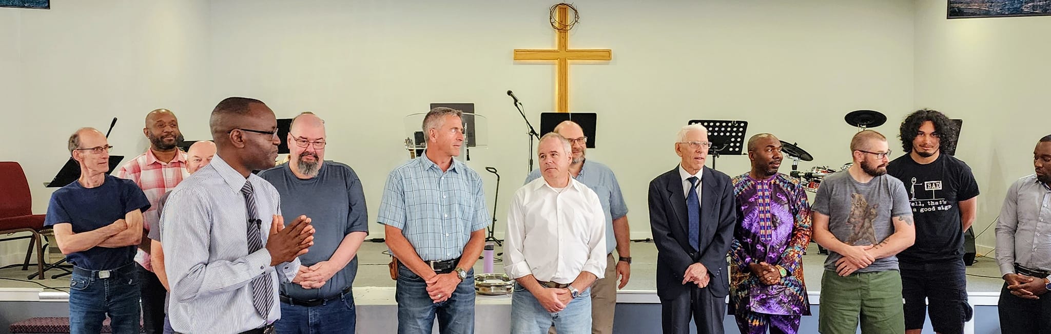 Church men gathered at the cross