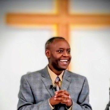 Pastor Fidele at the pulpit